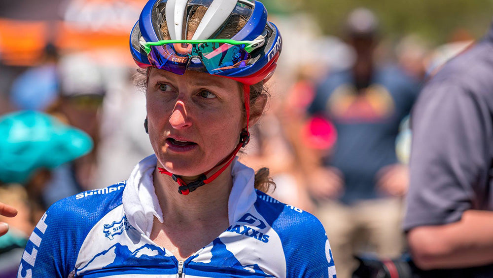 Catharine with a wet towel draped around her neck after a hot XC event.