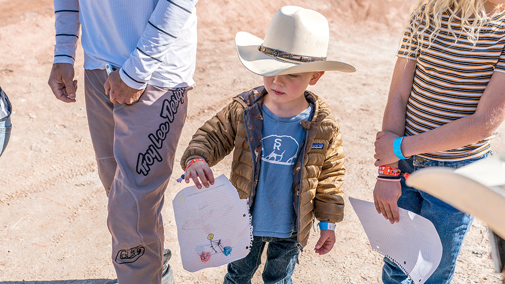 Cam Zink's son on course cheering on his dad